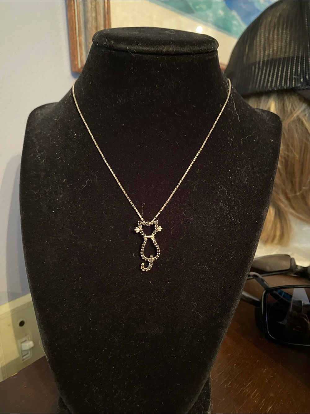 V! Silver tone necklace with cat pendant in good condition